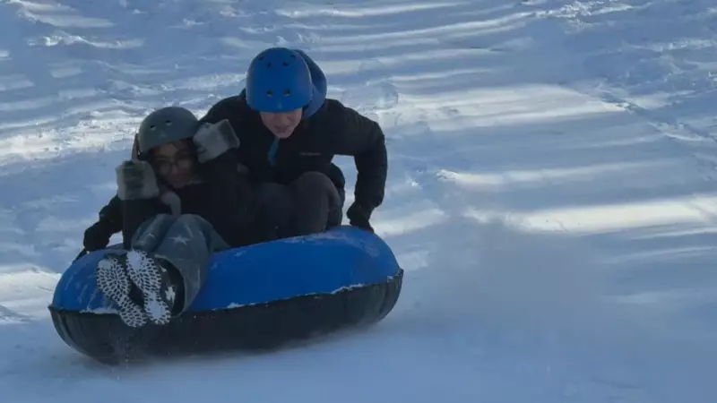 Calgary Snowstorm Aftermath: Students Toboggan While Drivers Scramble for Tires