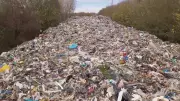Massive Illegal Trash Dump Near Oxford River Sparks Environmental Outcry