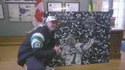 Riders QB Trevor Harris Honoured with Grey Cup Victory Painting