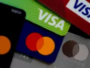 Visa, Mastercard Cut Fees, Let Retailers Reject Premium Cards