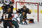 Dustin Wolf's 26 Saves Lead Flames to 4-1 Victory Over Surging Wild