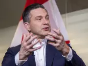 Poilievre Slams Liberal EV Mandate as 'Useless' in Year-End Interview