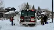 Winnipeg neighbours dig out fire truck trapped in snow after winter storm