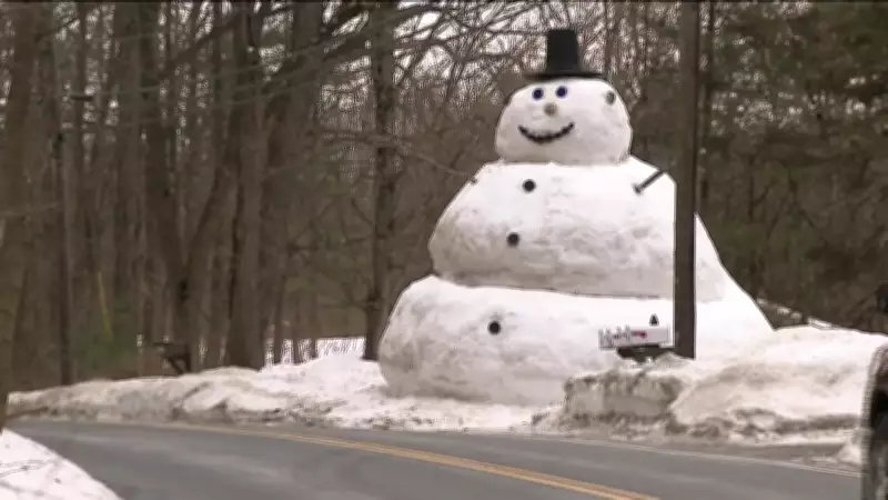 Father Builds 20-Foot Snowman for Daughter After Winter Storms in Shirley