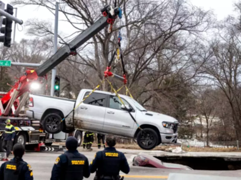 Sinkhole Swallows Two Vehicles at Omaha Intersection, No Injuries Reported
