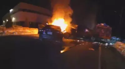 Massachusetts Police Officer's Body Camera Captures Dramatic Rescue from Burning Truck