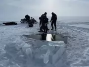 Two Snowmobilers Found Dead Under Ice of Frozen B.C. Lake After Tragic Accident