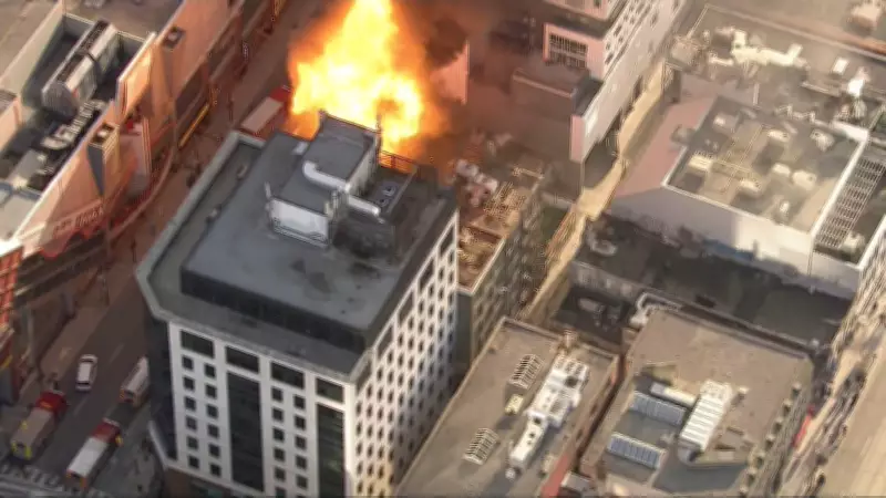 Toronto Fire Crews Battle Blaze Involving Propane Tanks on Downtown Building Roof