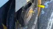 Commercial Trailer Tire Missing Large Chunk on Highway 400, Police Stop Vehicle