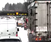 Commercial Truck Carrying Crane Strikes Overpass in Langley, BC; Highway Patrol Investigates
