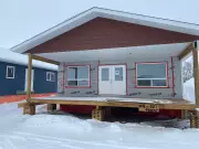 First Replacement Home Arrives in Denare Beach After Wildfire Destruction