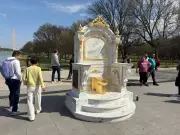 Golden Toilet Sculpture Appears on National Mall, Sparking Public Curiosity