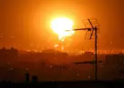 Iran Vows Months-Long Retaliation as Tehran Chokes on Smoke from Oil Fires