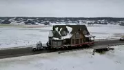 Massive Log Home Nears Journey's End After Epic Transport from Lajord