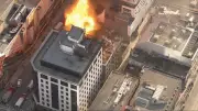 Toronto Fire Crews Battle Blaze Involving Propane Tanks on Downtown Building Roof