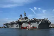 U.S. Navy Warship USS Tripoli Tracked Heading to Middle East with Marine Troops