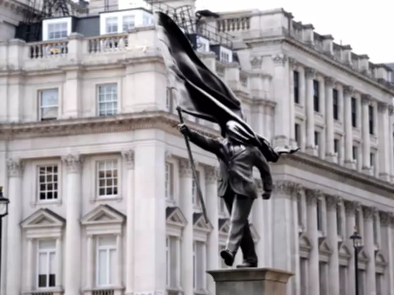 New Banksy Statue Appears in London: Man with Flag-Covered Face Draws Crowds