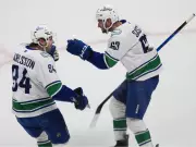 Canucks Stun Avalanche in 8-6 Thriller as Boeser Nets Hat-Trick