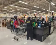 OPP Officers Volunteer at Grocery Stores to Fund Annual Summer Camp for Youth