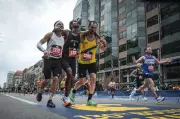 Two strangers help runner finish Boston Marathon in heartwarming act