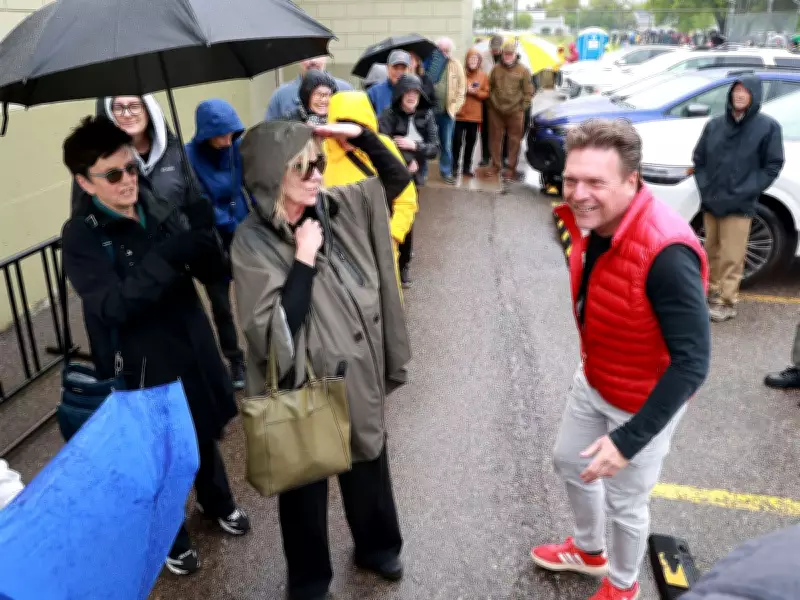 Calgarians brave rain for Forever Canadian lawn sign event