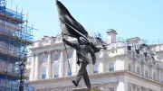 Banksy Confirms New Sculpture of Flag-Bearing Man Near London Mall