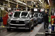 Nissan reduces losses, expects return to profit in recovery