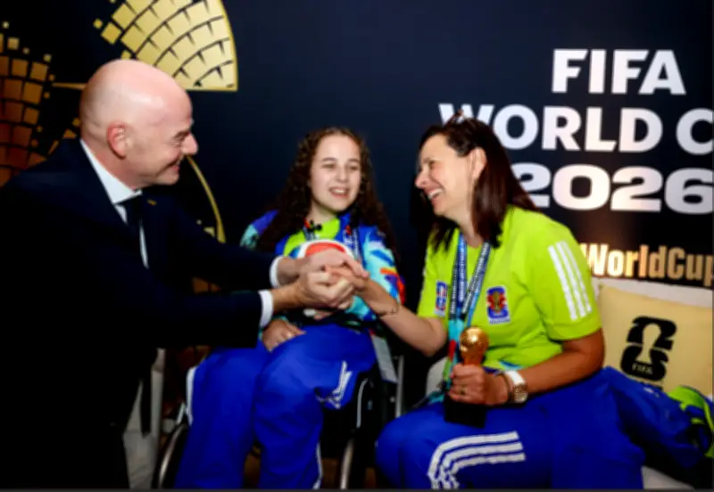 Blind volunteer in wheelchair wins FIFA Unsung Hero award at World Cup in Toronto