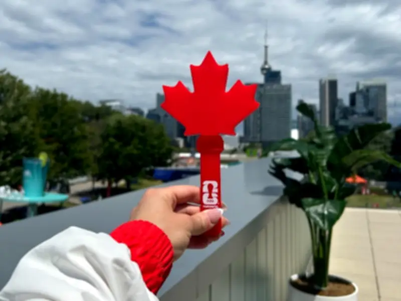 Canadian World Cup fans cheer with maple leaf-shaped clappers