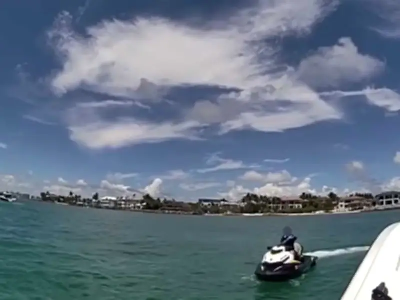 Florida boy, 8, stopped for riding jet ski alone; father also charged