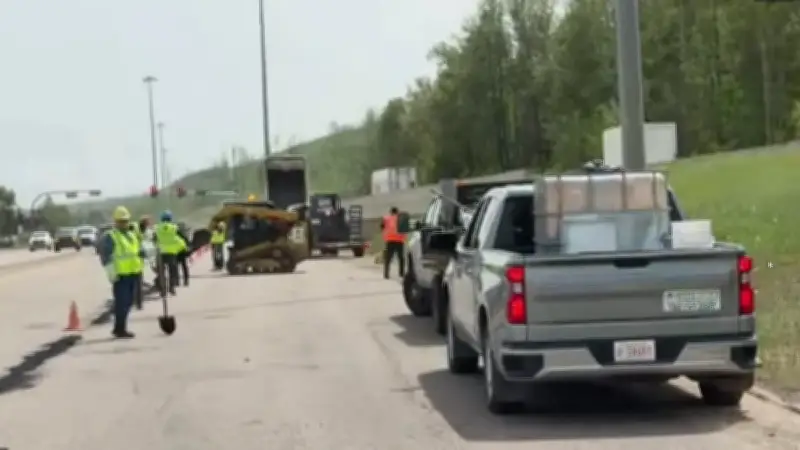 Fort McMurray Residents Patch Potholes on Highway 63 in Protest