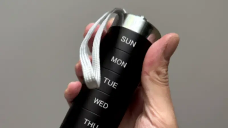 Sleek Aluminum Pill Organizer Holds 12 Pills Per Day, Won't Pop Open