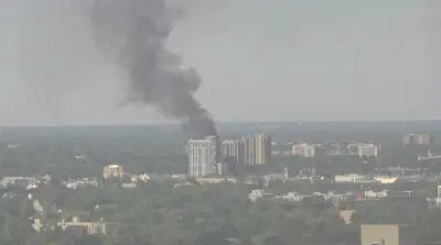 Black Smoke from Rail Tie Fire Billows Over London, Ontario