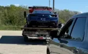 Ferrari driver stops in traffic lane to avoid scratching paint on gravel shoulder