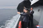 North Korea's Kim Jong Un Shows New Warship Ahead of Xi's Visit
