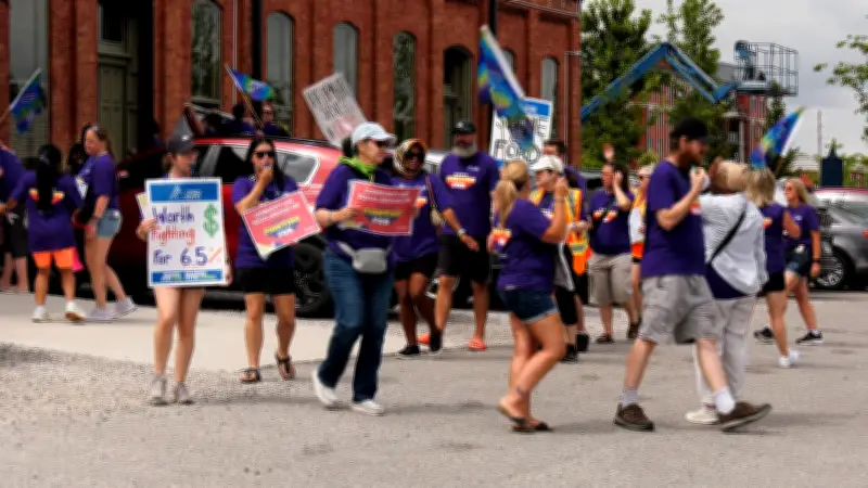 Striking workers confront MPP Rob Flack at London luncheon