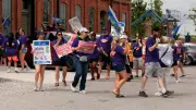 Striking workers confront MPP Rob Flack at London luncheon